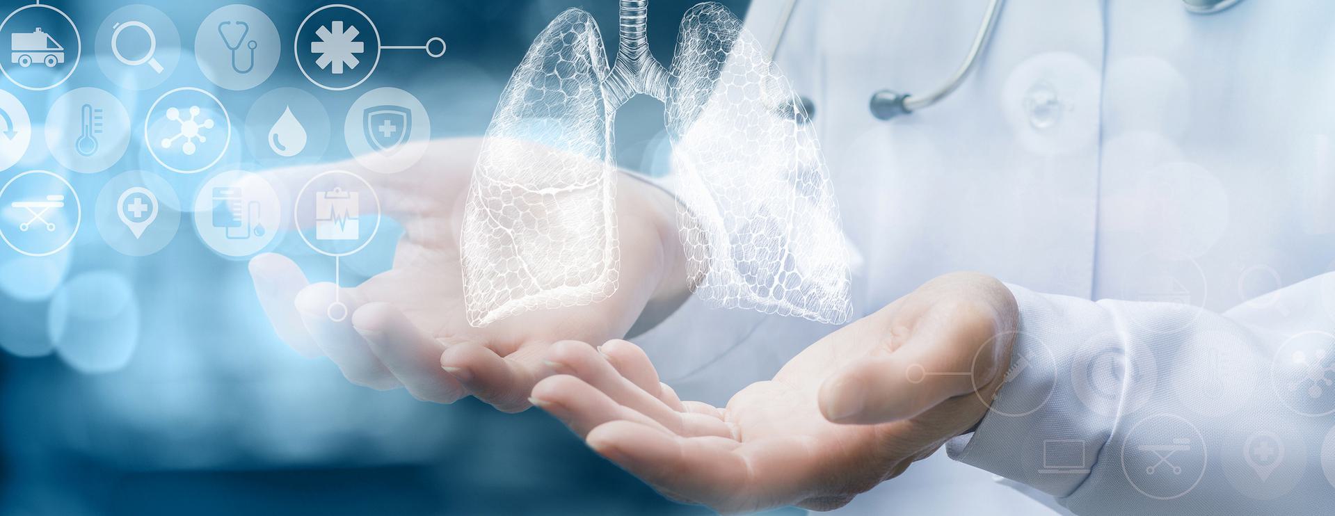 Doctor holding a digital representation of human lungs with medical icons in the background.