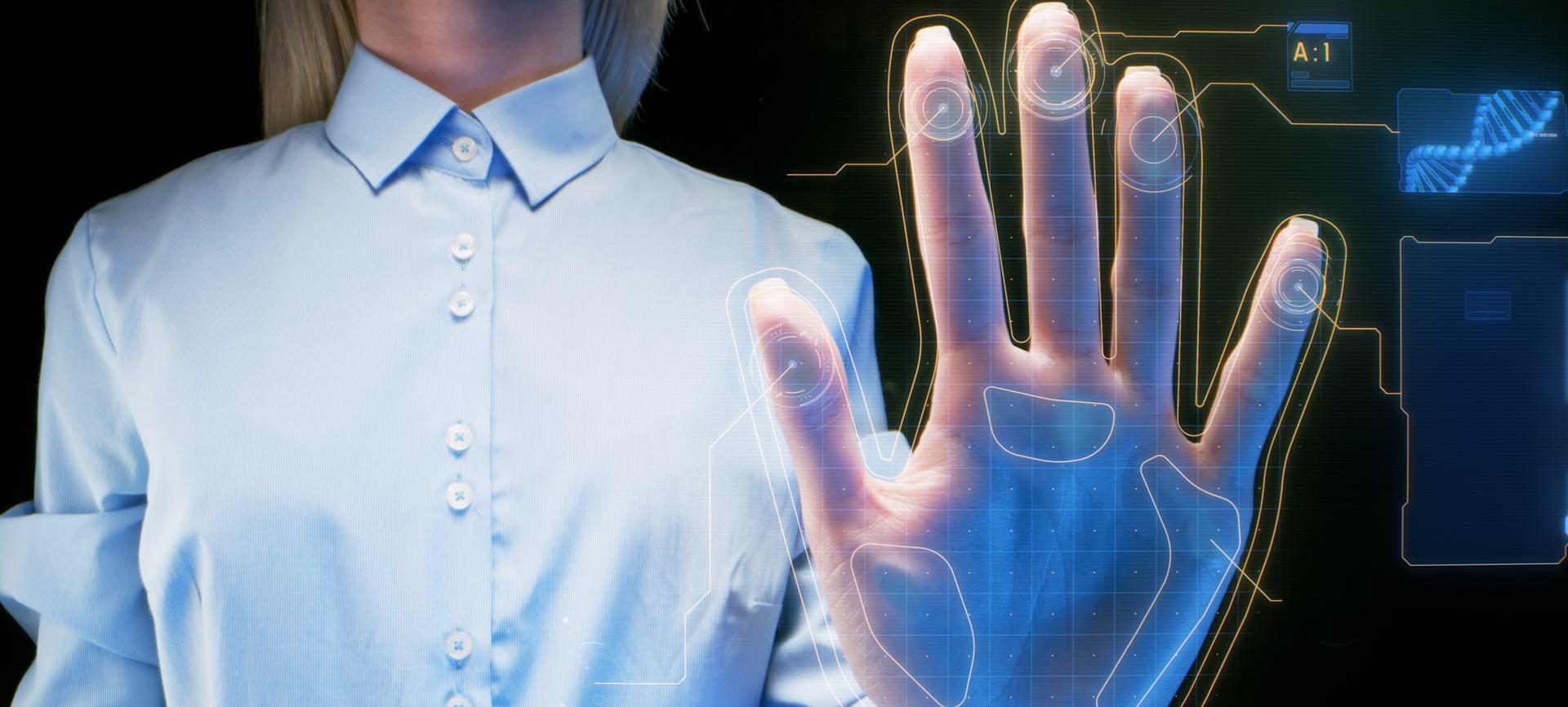 Platinum Background Package Person in a blue shirt using a digital hand scanner with holographic interface.