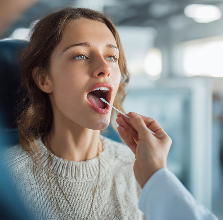 Doctor gathering a saliva sample for drug test. 